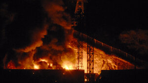 Rig on fire at night
