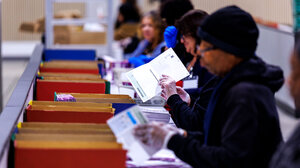 Election workers handling ballots