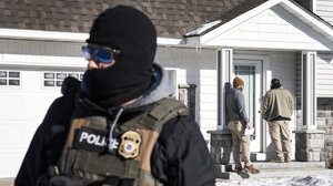 ICE agents outside a private home in Minneapolis