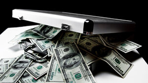 Cash spilling from silver briefcase