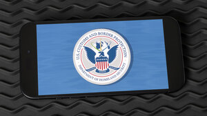 Graphic of DHS seal displayed on a smartphone screen