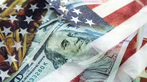 Twenty dollar bill overlaid on American flag