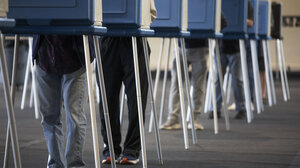 voting booths, legs only visible
