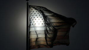 Black and white American flag image with sun shining through stars