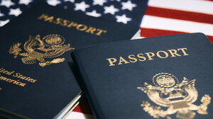 Two U.S. Passports on top of U.S. flag