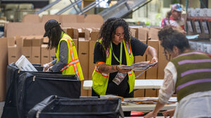 Election workers handling ballots