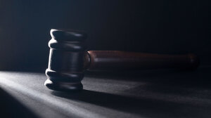 Gavel in a dark room
