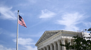 A flag flies in front of the U.S. Supreme Court
