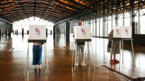 Voters filling out their ballots