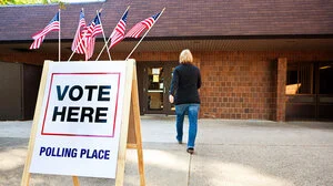 A voter walks into a polling place