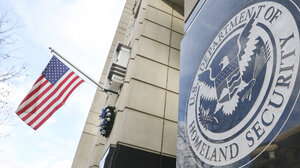 DHS seal and U.S. flag