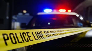 Crime scene tape and police car
