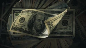 Spread stack of $100 bills